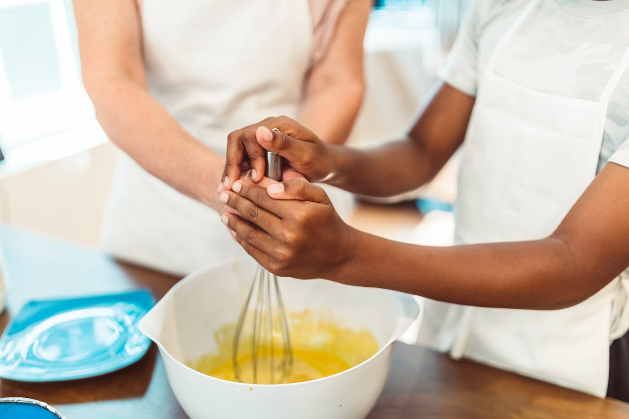Two people preparing ingredients together.